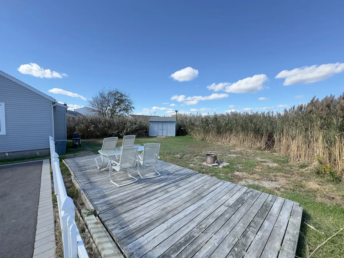 The wooden deck walkway leading toward the bay